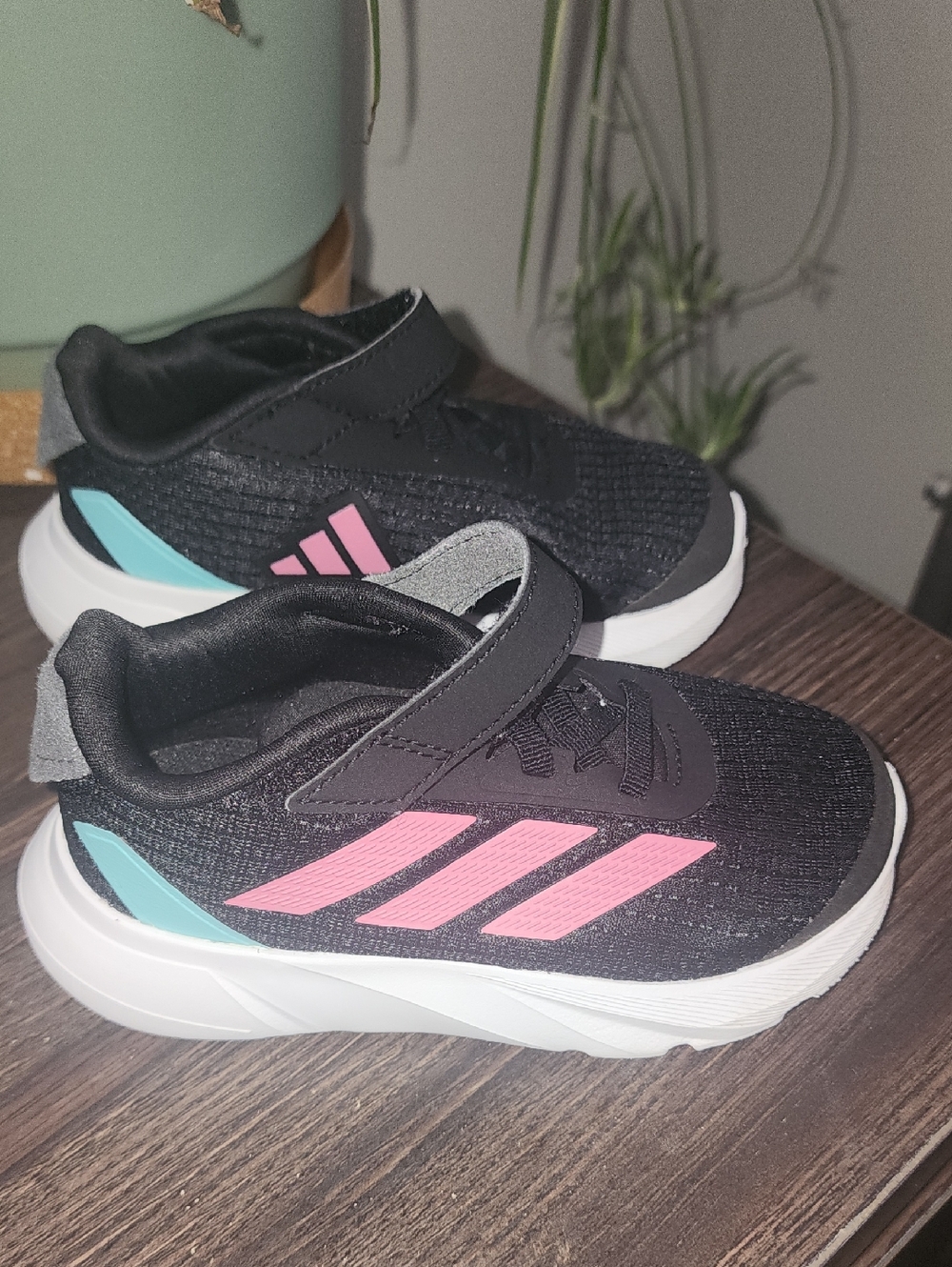 adidas Kids Black Sneakers with Pink Stripes and Teal Heel Accent
